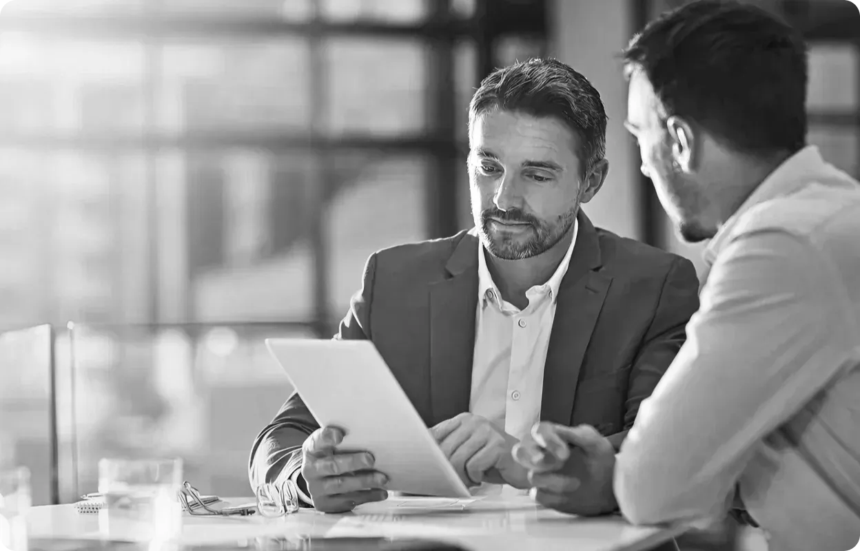 Two businessmen discussing global localization strategy