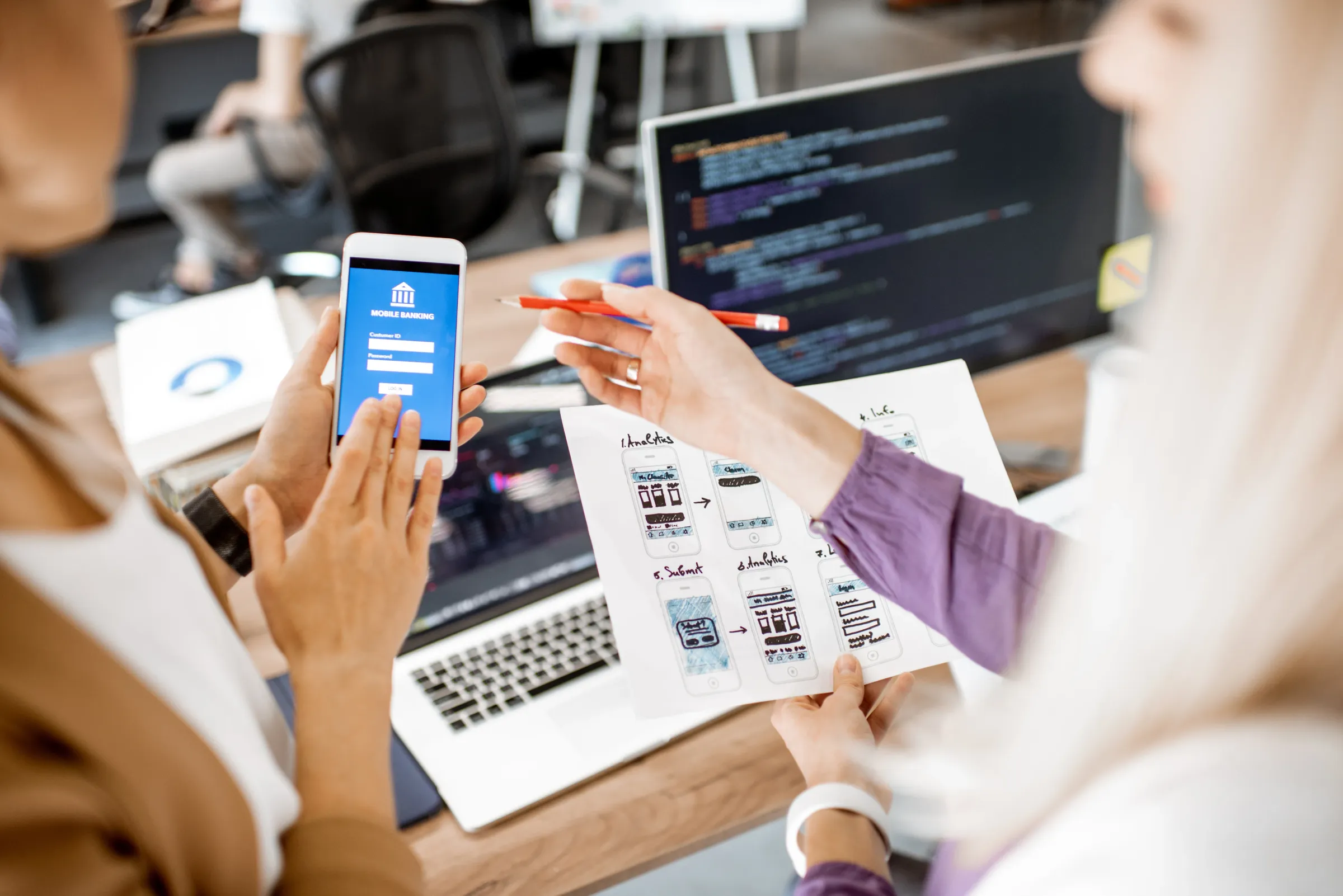 Creative Labs team working on mobile app design process