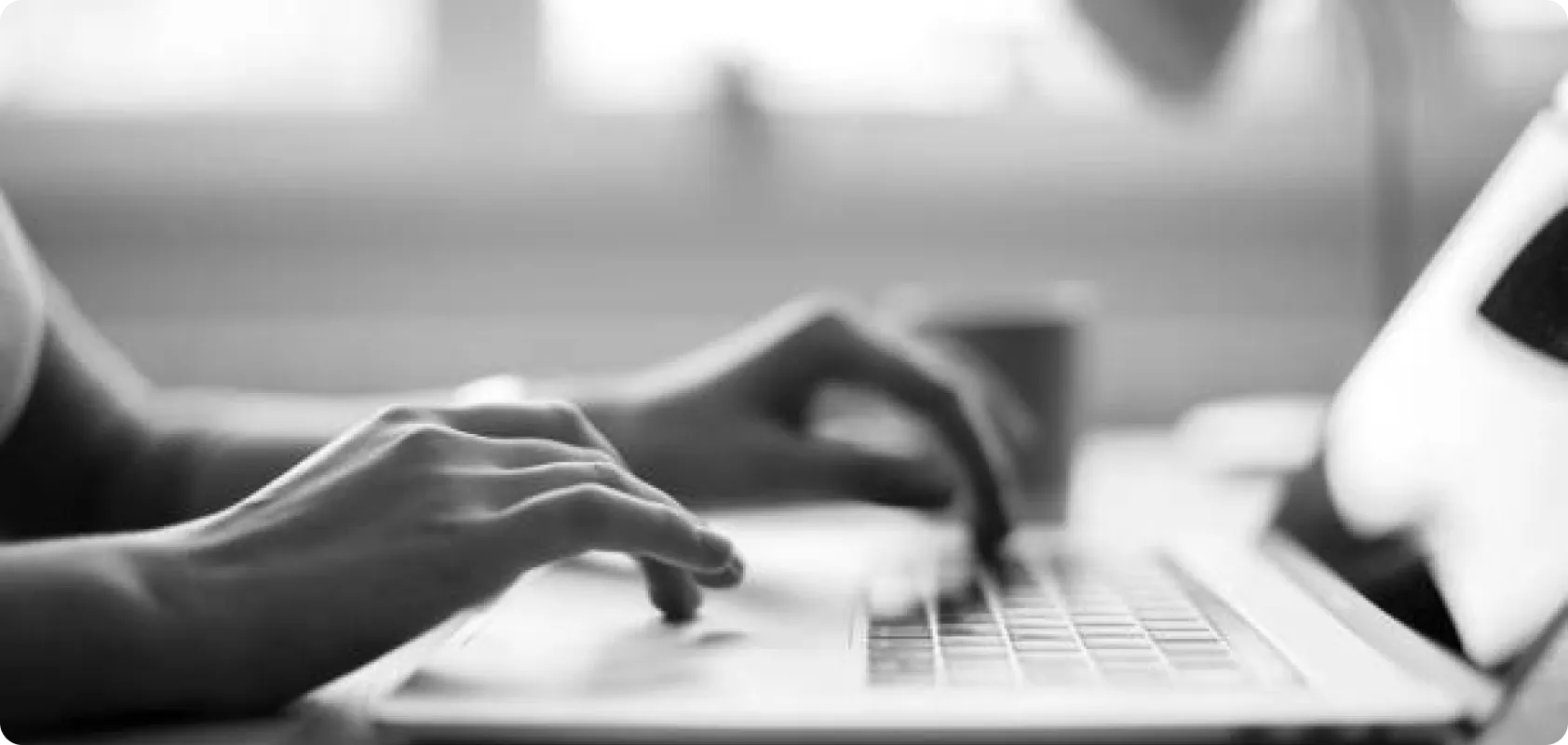 Hands typing on laptop — start your global SEO journey