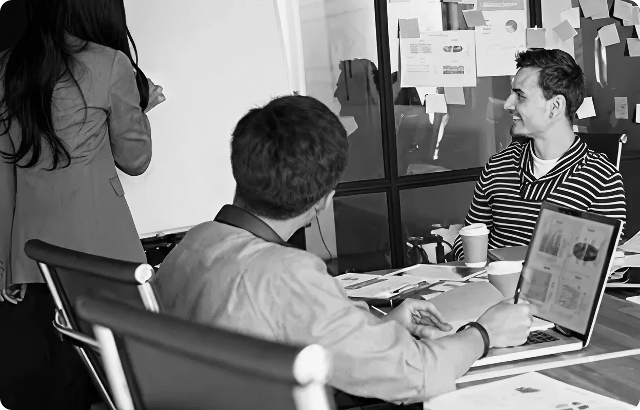 Team meeting discussing store setup strategy