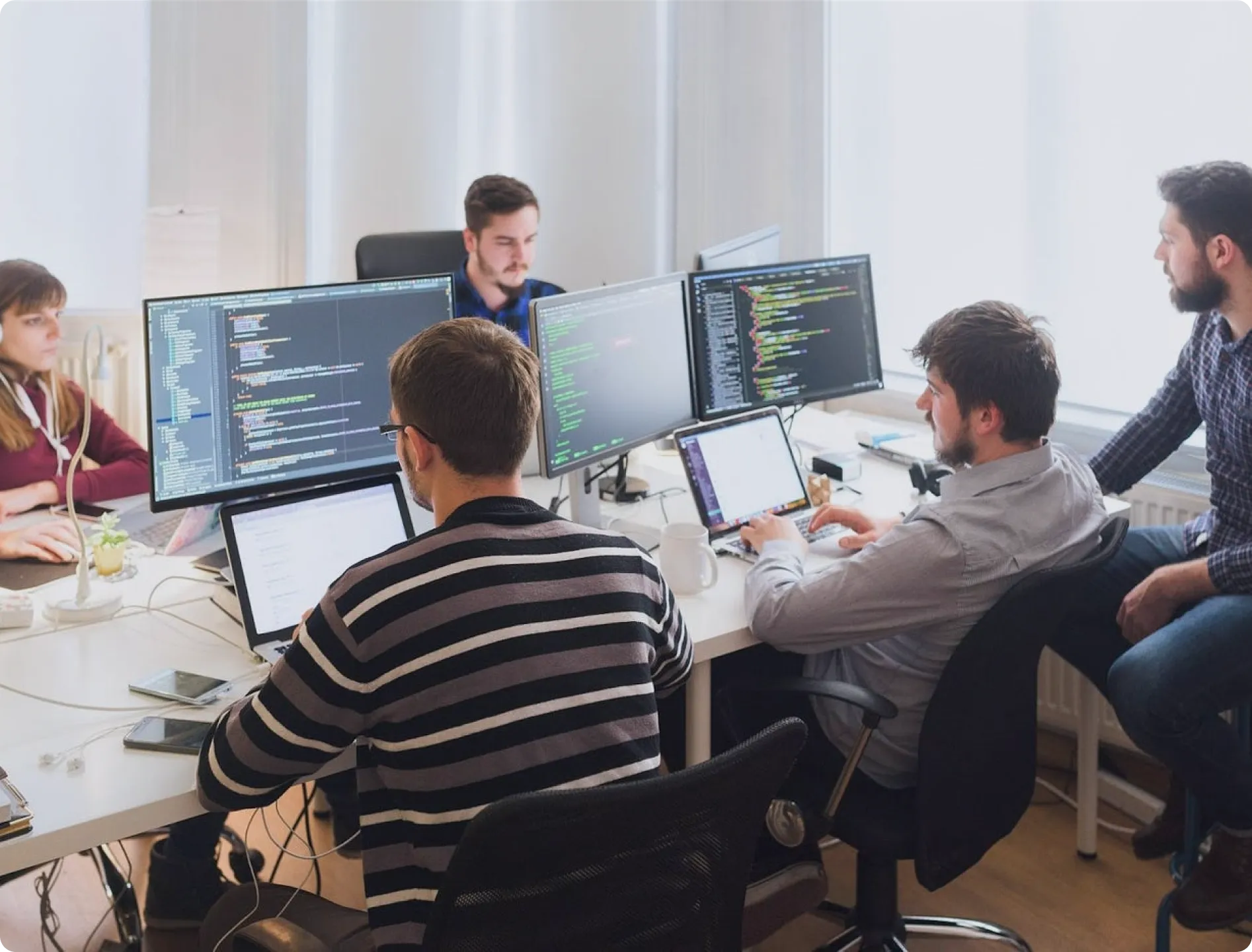 Development team working at monitors