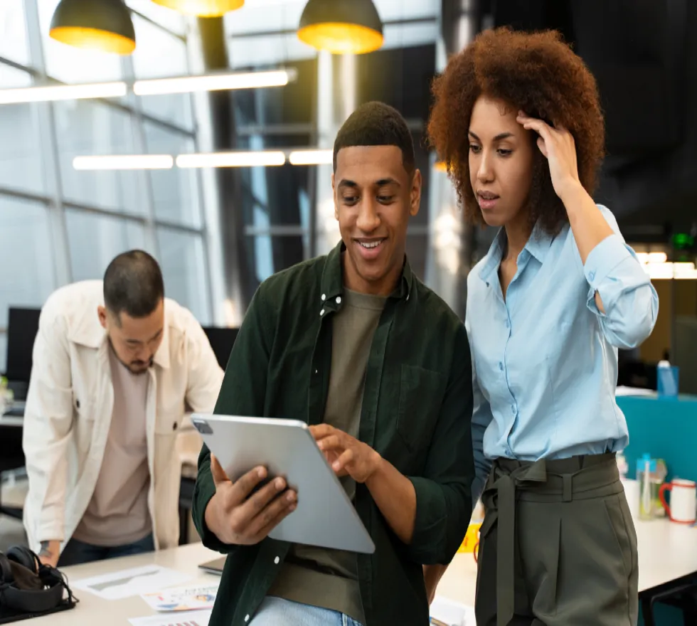 Team collaborating with tablet