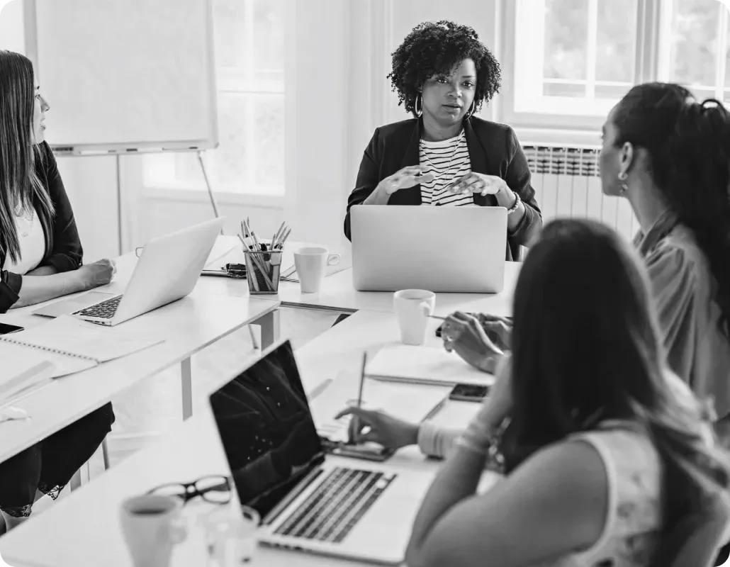 Team at desk discussing migration strategy